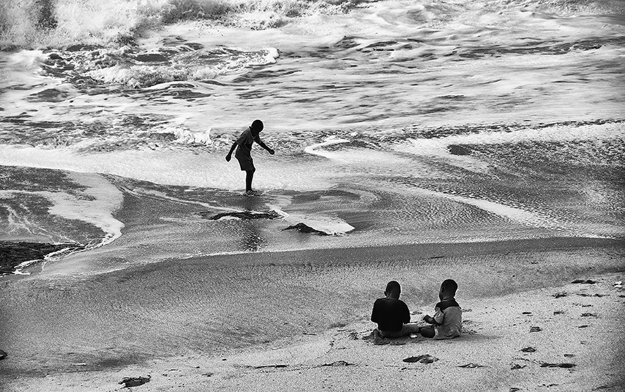 three boys on a beach 